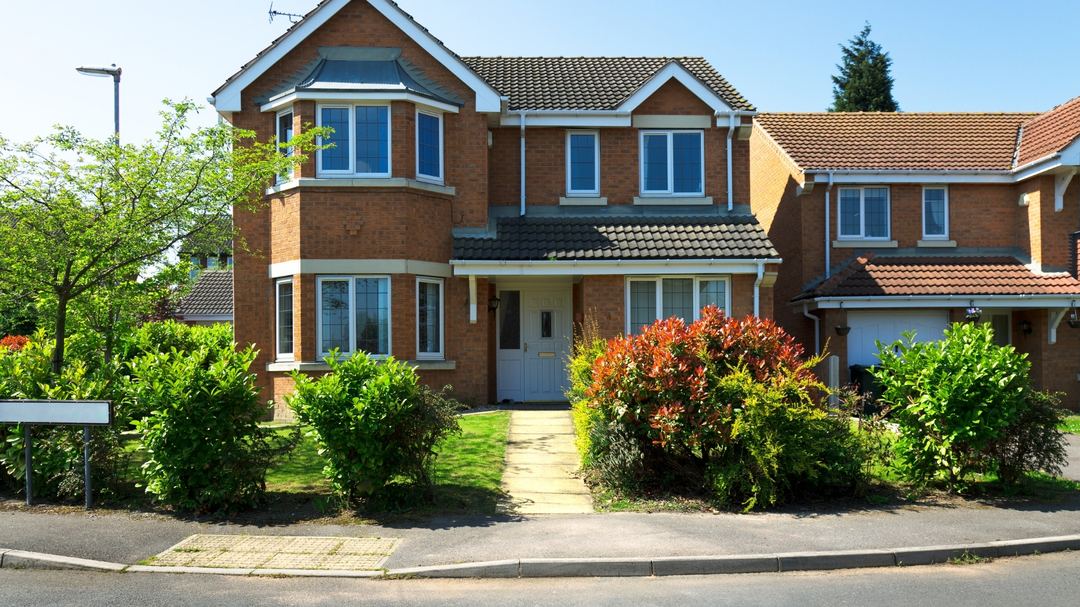 A modern brick home on a quiet street
